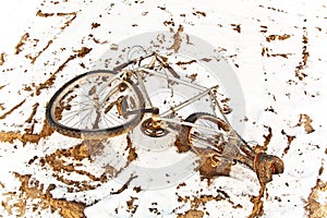 Rusty bicycle as trash on snow