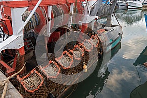 Rusty boat and nets for catching scallops