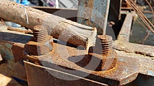 Rusted bolt nut on a mechanical construction