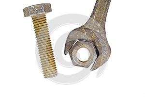 Rusty bolt, nut and spanner over is