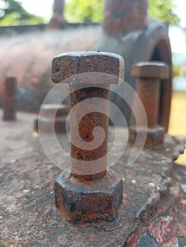 Rusty bolt, part of an abandoned train wreck
