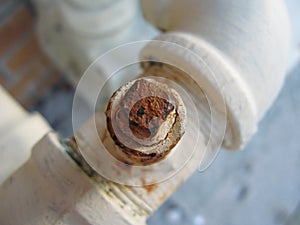 Rusty bolt on water pipe
