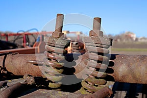 Rusty bolts and nuts on agricultural machinery