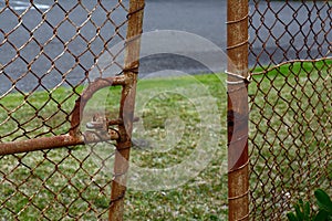 Rusty and broken gate photo