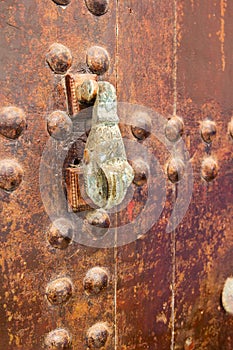 Rusty bronze hand door knock