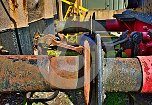 The rusty buffers of two old railway cars collide, transport photo