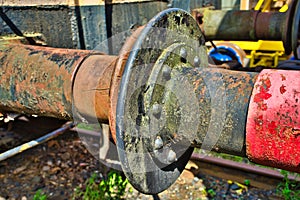 The rusty buffers of two old railway cars collide, transport