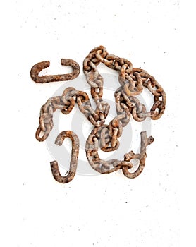 Rusty c-shaped scrapers and chain on white background