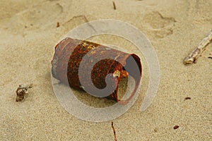 Rusty can on beach