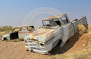 Rusty car wreck at last station in Namib desert