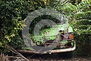 Rusty car wreck in the woods
