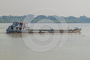 Rusty cargo ship on Pangunchi river, Banglade