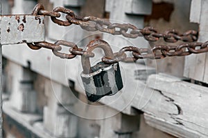 rusty chain closed padlock, closed gate