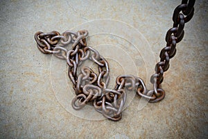 Rusty chain on floor