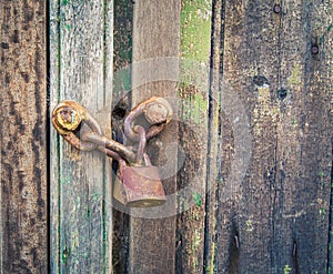 Rusty chain and lock on a door
