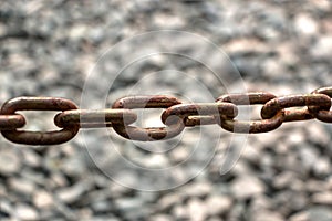 Rusty Chain in Natural Blurred Background