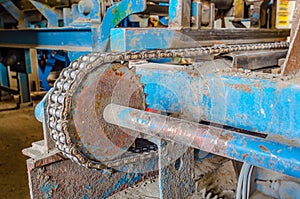 Rusty chain on old equipment. Industrial background of worn device chain