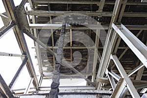 Rusty chain on wheel in abandoned industrial coal factory