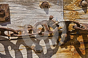 A Rusty Chain on Wood