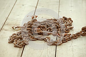 Rusty Chain on Wooden Deck