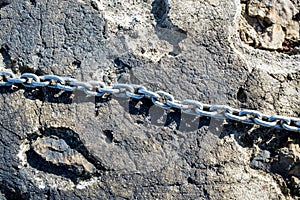 Rusty chains on the docks of the harbor