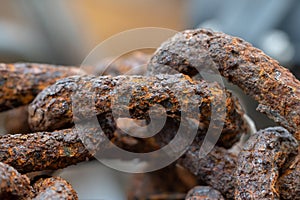 Rusty chains eroded by sea water