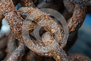 Rusty chains eroded by sea water