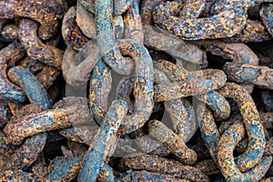 Rusty chains eroded by sea water