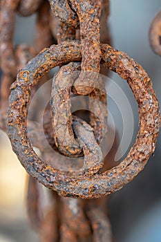 Rusty chains eroded by sea water