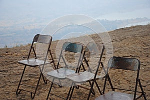 Rusty chairs on the mountain