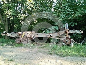 Chassis of old Landrover in grass photo