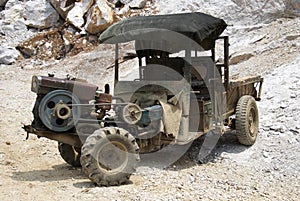 A rusty Chinese pickup truck