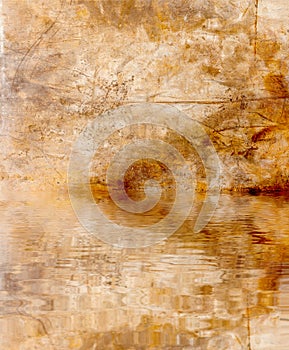 Rusty corroded background with the water reflection