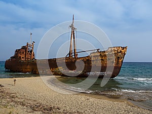 Rusty corroding Dimitrios shipwreck on a sandy beach near Gythio, Greece