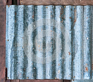 Rusty corrugated galvanized steel wall or iron metal sheet surface for texture and background