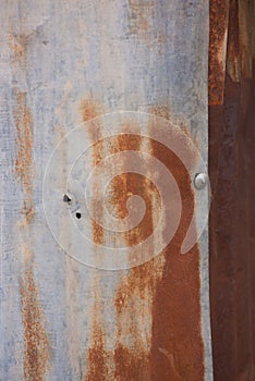 Rusty corrugated steel roofing sheets