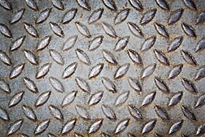 rusty diamond metal plate texture pattern used as abstract background