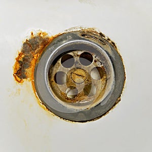 Rusty drain hole in the bathroom