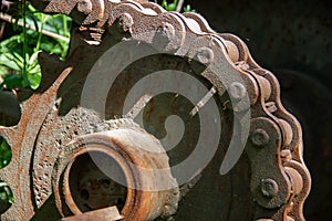 Rusty driving gears with chain on a old mine train wagon