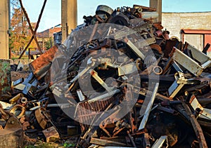 Rusty engines stacked in the scrapyard. Engine parts greased and covered with rust.