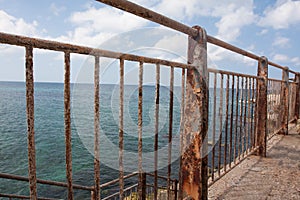 Rusty fence near the sea