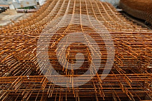 Rusty fittings. rusty construction metal mesh. Rusty Metal armature net for building construction. metal rebar for