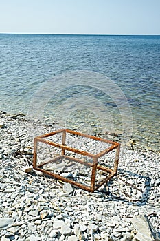 Rusty frame a box on the beach