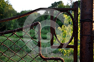 Rusty garden gate art deco style metal old green garden, park