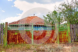 Rusty gate of rural house