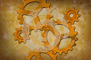 Rusty gears against a mottled yellowish background