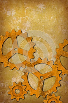 Rusty gears against a mottled yellowish background