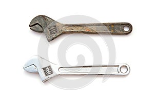 A rusty and a good wrenches on white