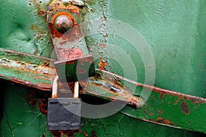 rusty green metal texture of cargo container with lock and bolt