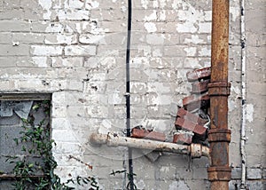 Rusty Grunge Drainpipe with Bricks